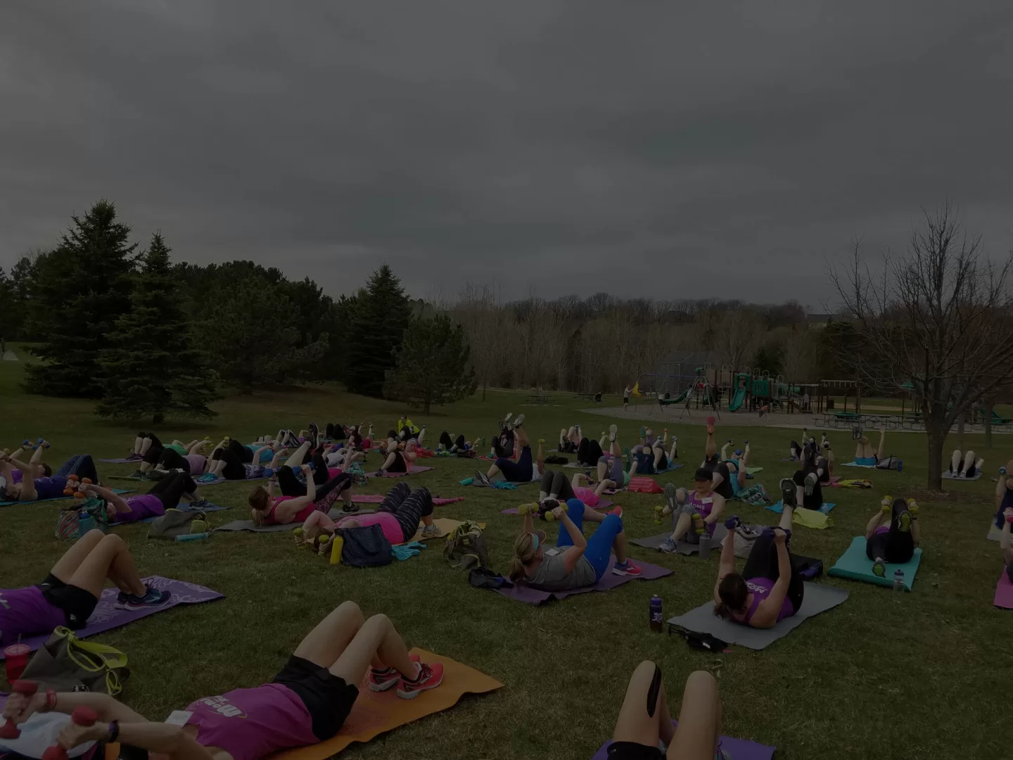 MOTR members on yoga mats with weights