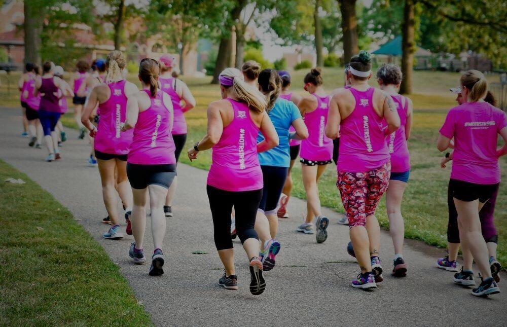 A large group of MOTR members running in a pack