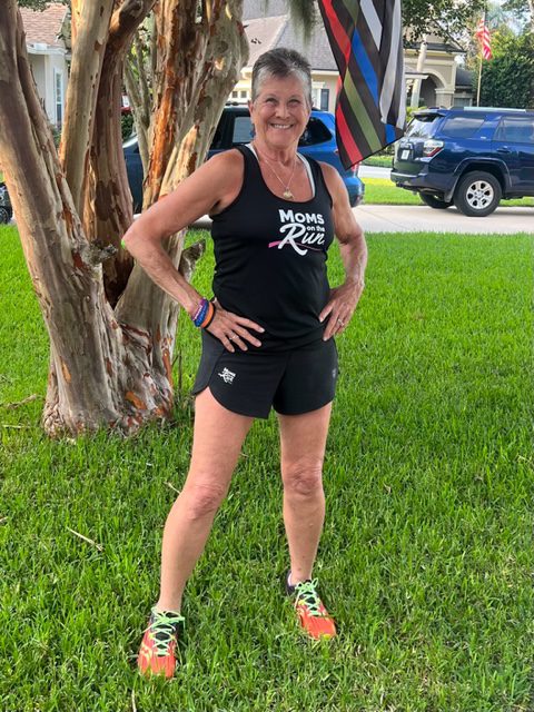 Coach KC of Nocatee standing in front of a tree with her hands on her hips