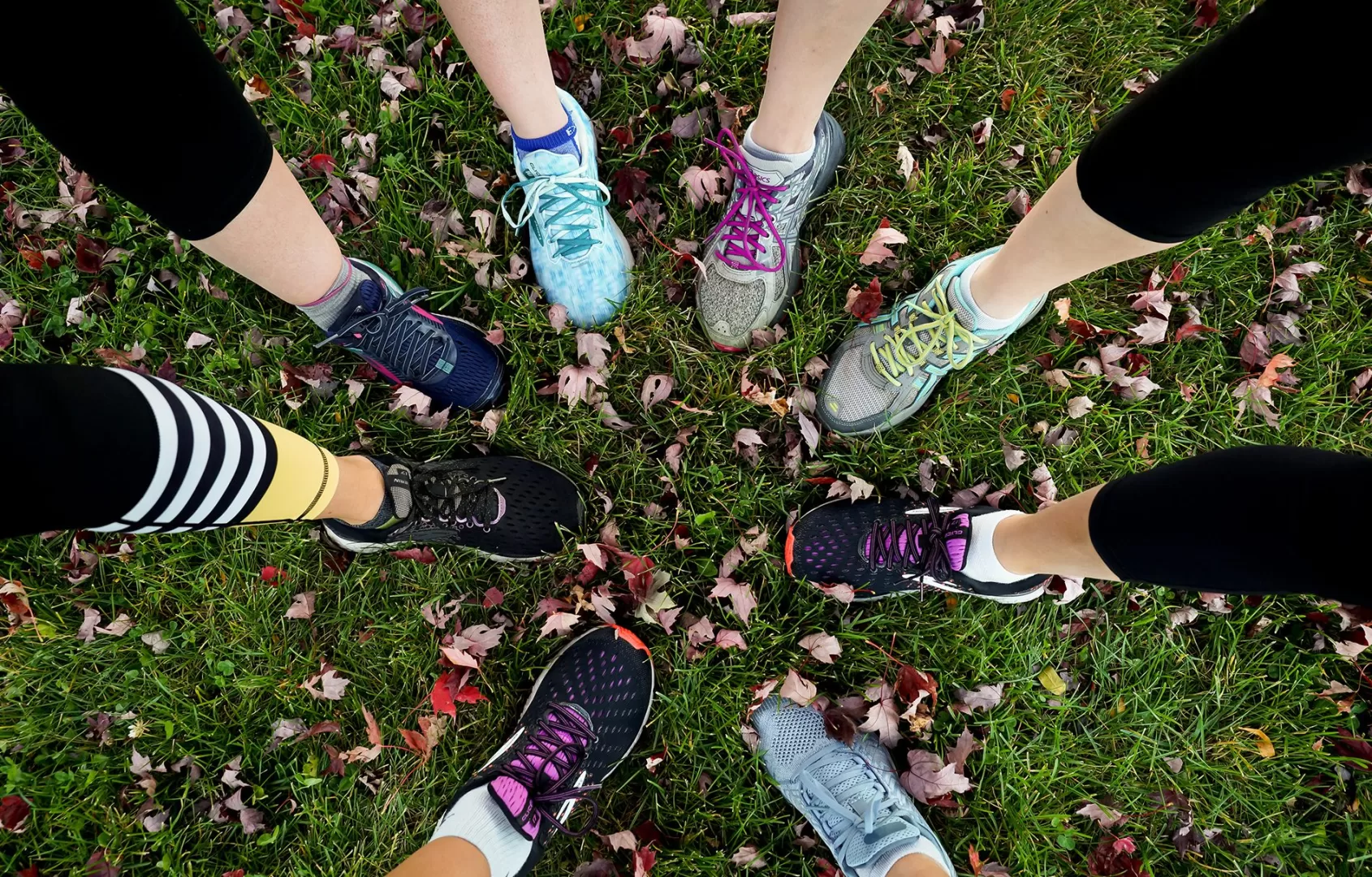 Multiple running shoes arranged in a circle