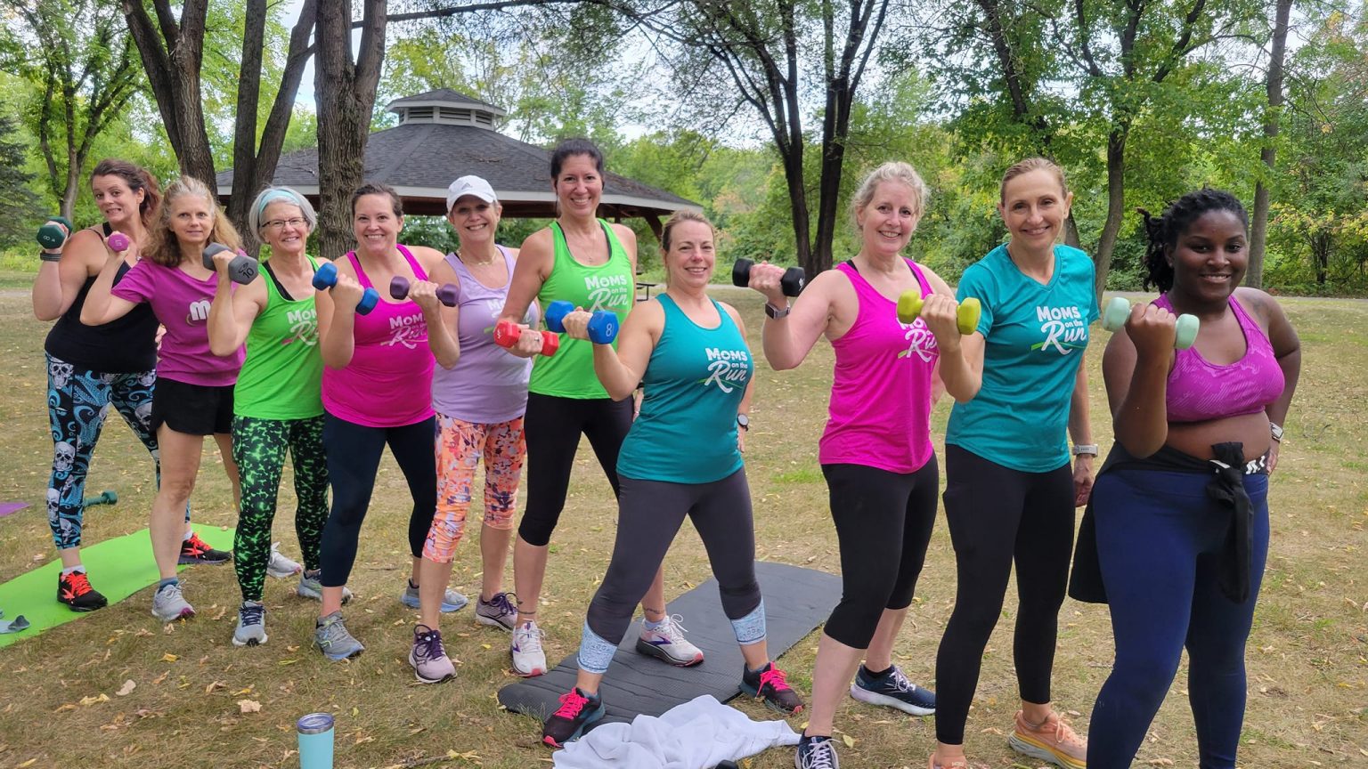 Moms on the run members lifting weights