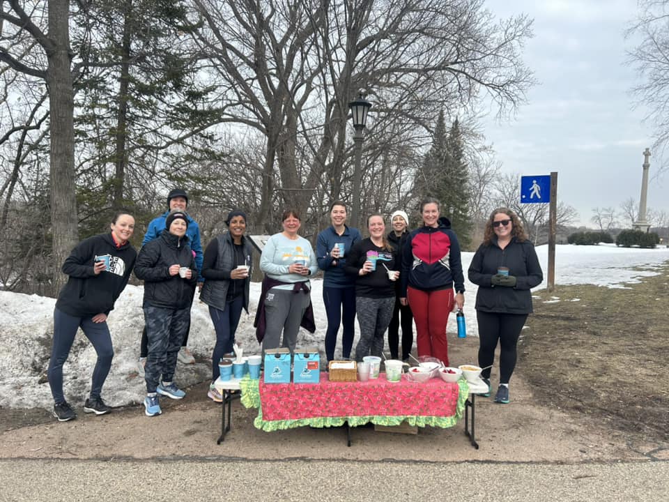 A group of MOTR members by a picnic table