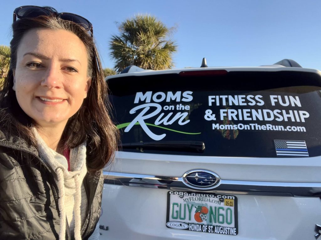 MOTR Founder and CEO, Karissa Johnson, standing in front of a Moms on the Run branded van