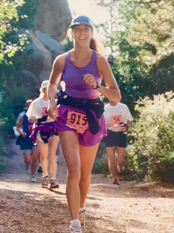 Coach Michelle, from the Chanhassen and Chaska Moms on the Run location running a trail race.