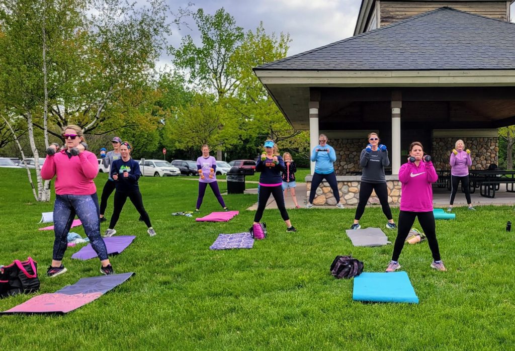 Woodbury MOTRs doing outdoor strength and conditioning by yoga mats