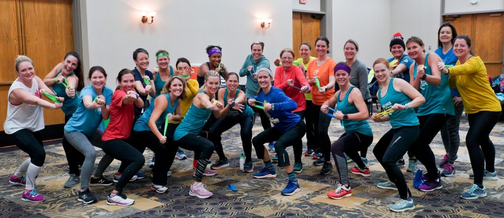 Large group of MOTR members working out indoors