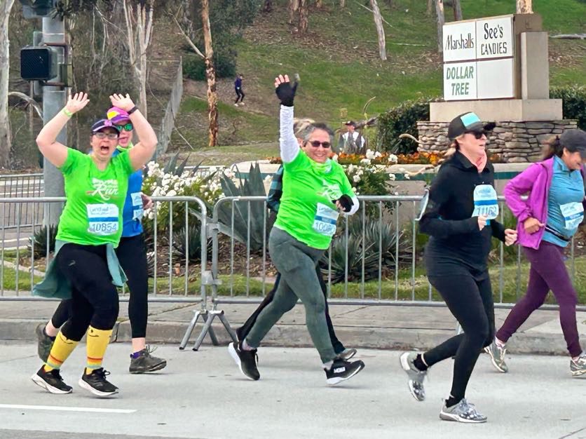 Moms on the Run waving at an event