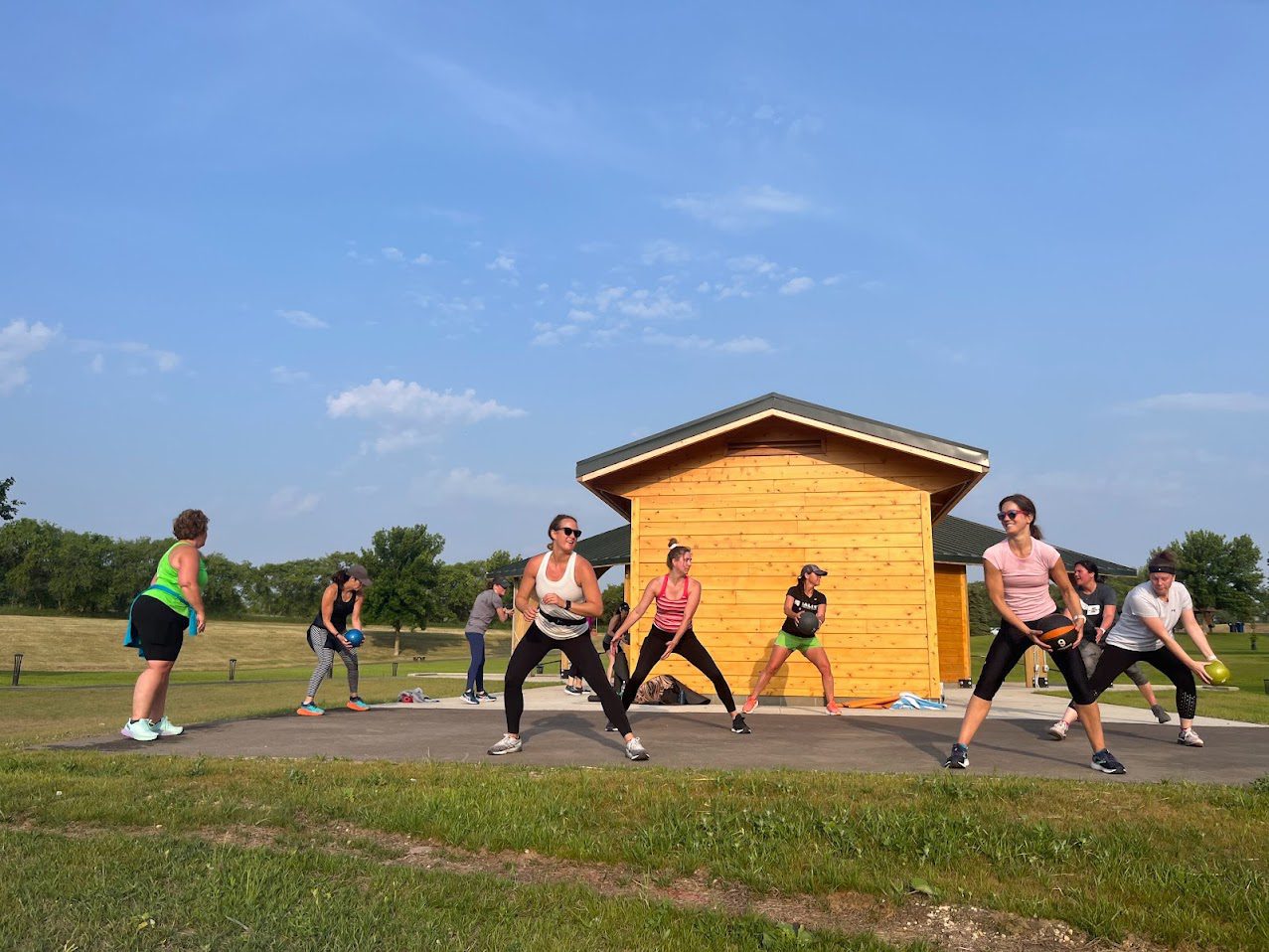 Burnsville-Lakeville members completing strength training outside
