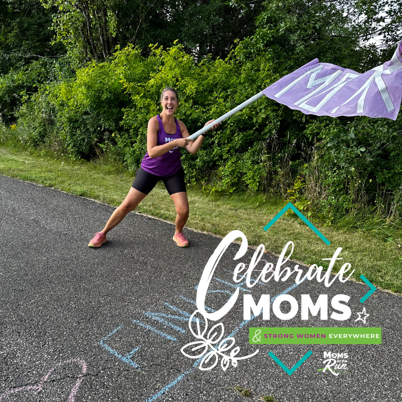 women waving MOTR flag at finish chalk line