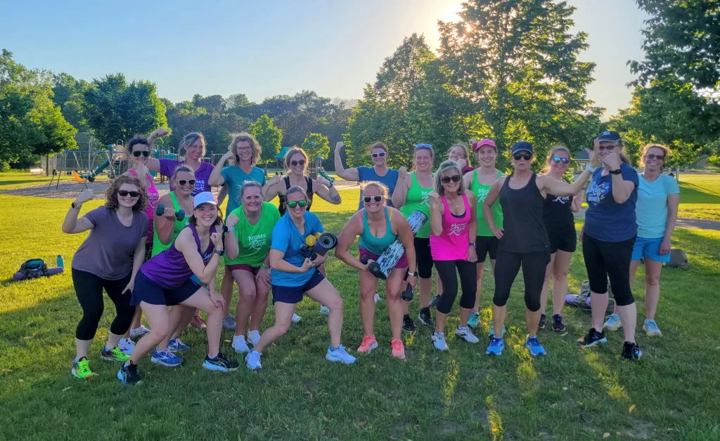 A large group of Woodbury members flexing their muscles