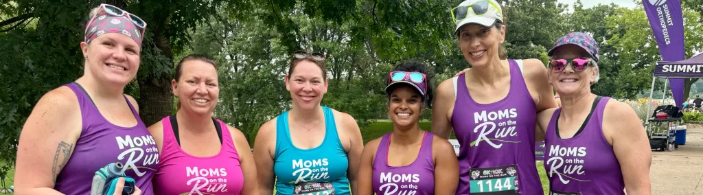 Female runners wearing colorful running tanks