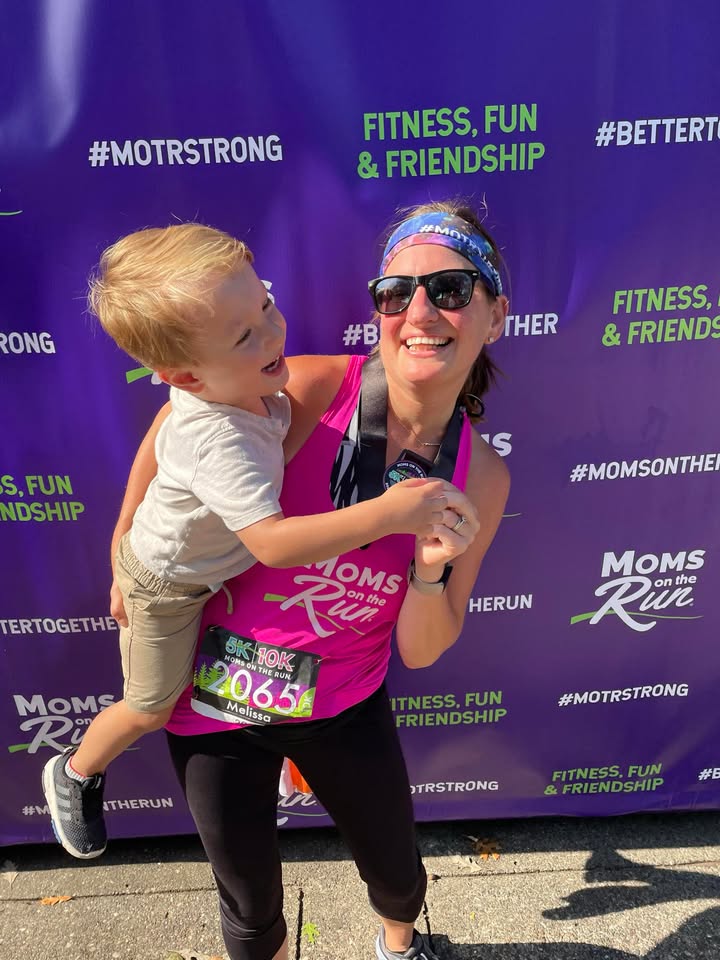 A MOTR member dancing with her son