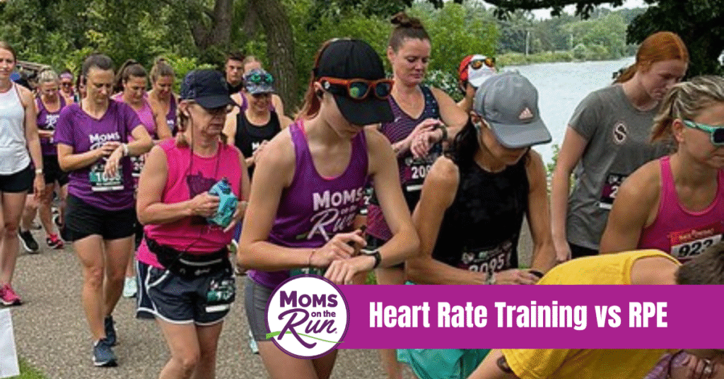 runners pressing start on watch at race
