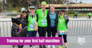runners wearing bright green shirts at finish line with medals