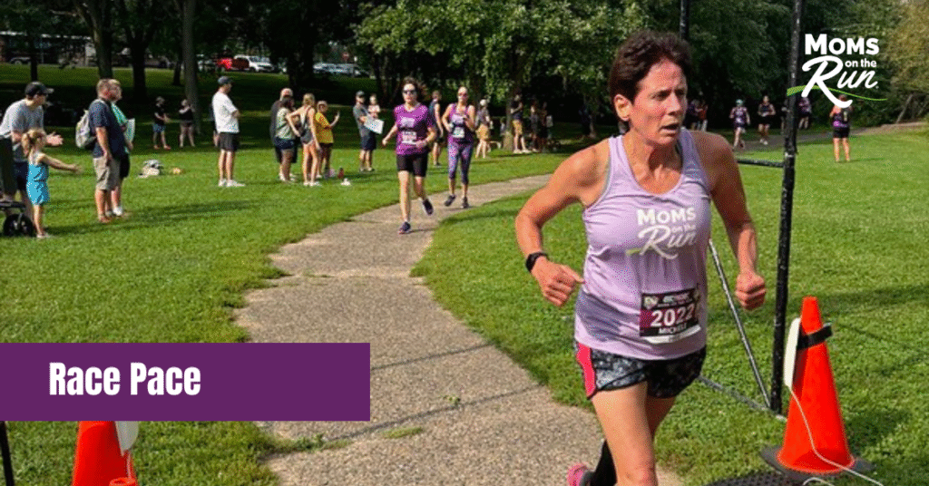 women in lavender shirt crossing finish line