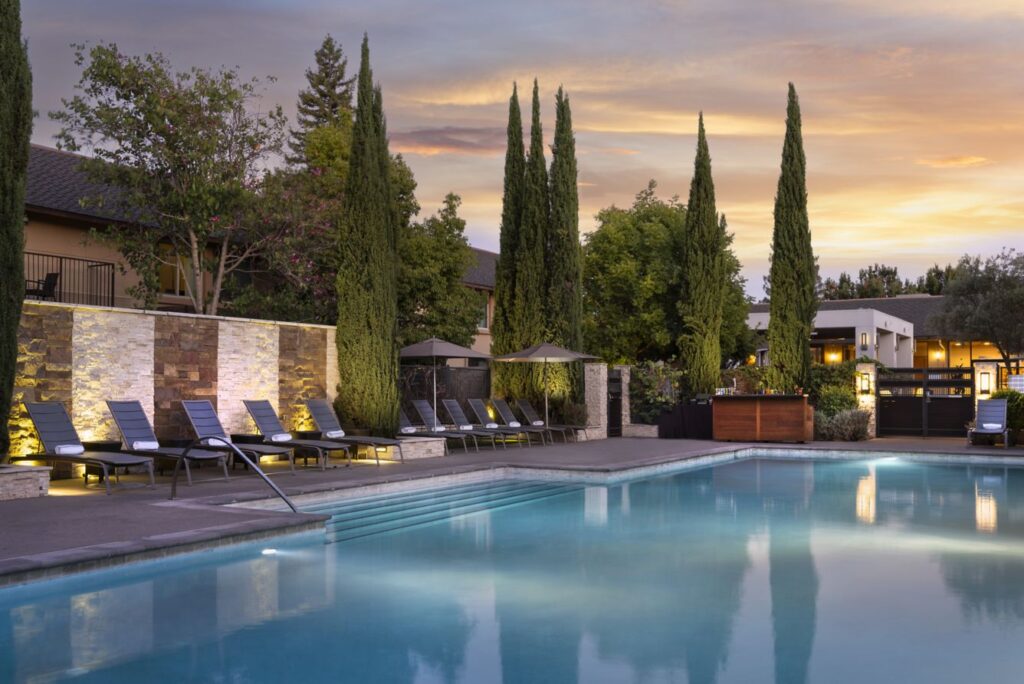poolside at dusk with trees in Napa
