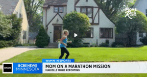 woman training in front of houses