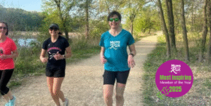 three women running on trail with most inspirational logo in corner