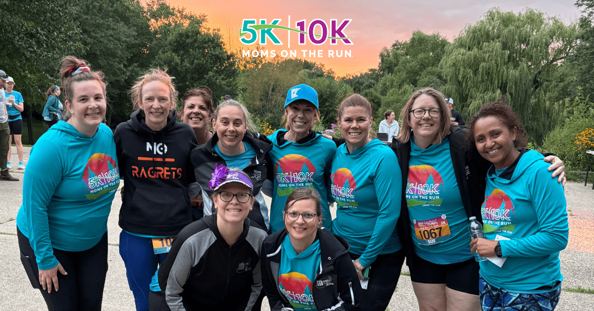 runners in teal shirts with sunset