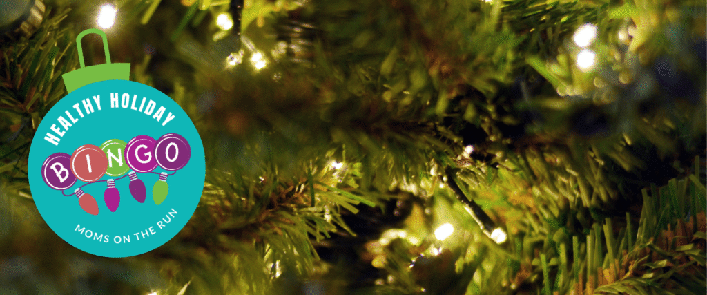 Christmas tree branches with lights and Healthy Holiday Bingo logo ornament