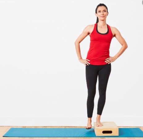 Woman with one foot on stool