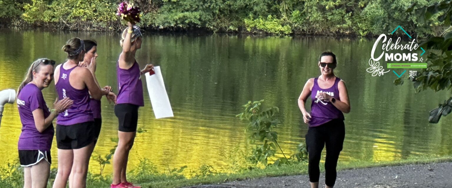 women cheering runner