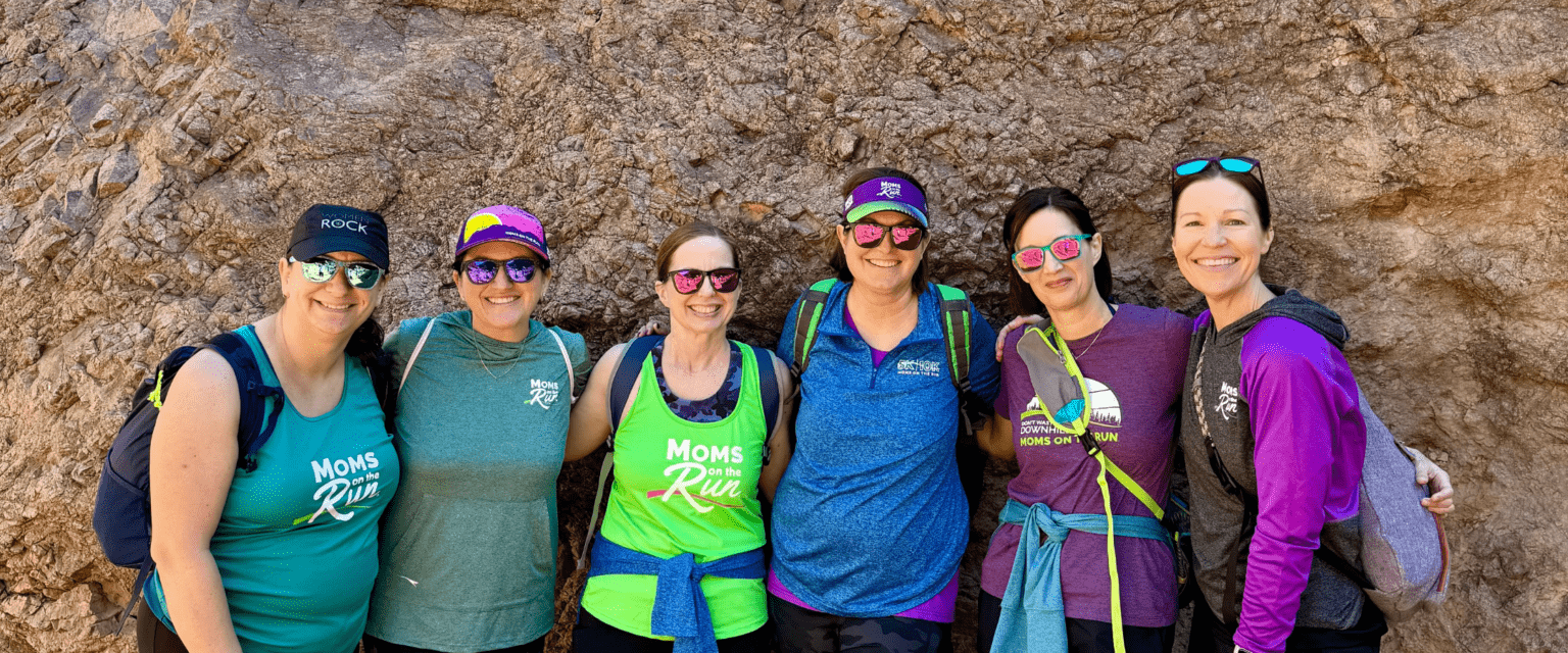 women from Moms on the Run in multi color shirts