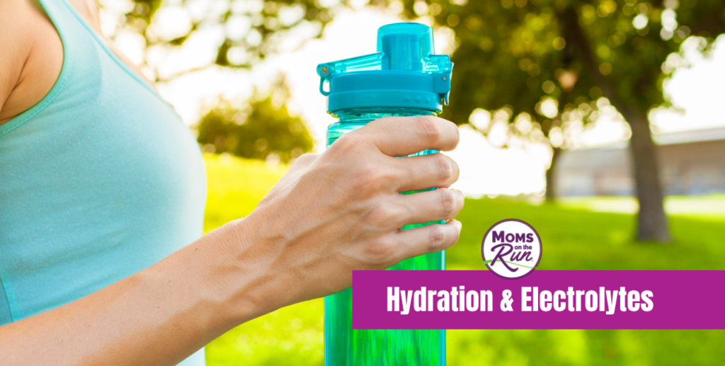woman in workout shirt holding water bottle