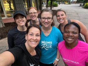 Members from Bloomington Moms on the Run smile for a photo